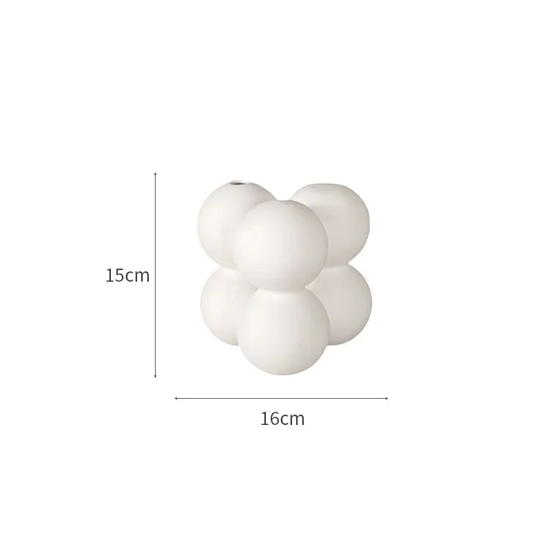 Set of white ceramic vases for home decoration.