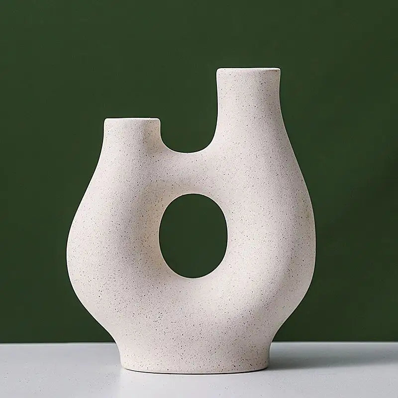 Abstract Hollow Ceramic Vase for Stylish Home and Office Decor.