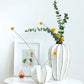 White Ceramic Vessel Handcrafted Wholesale Floral Masterpiece.