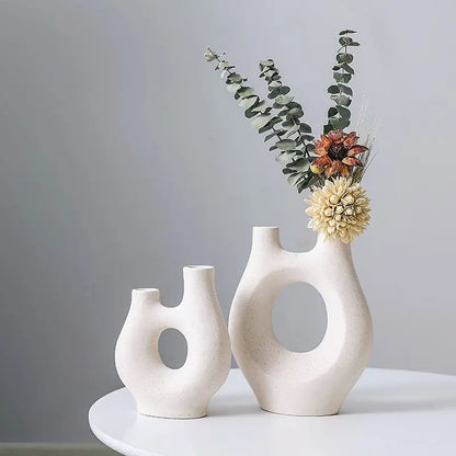 Abstract Hollow Ceramic Vase for Stylish Home and Office Decor.