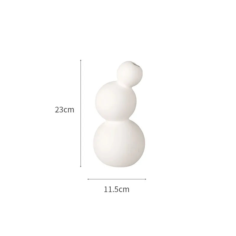 Set of white ceramic vases for home decoration.