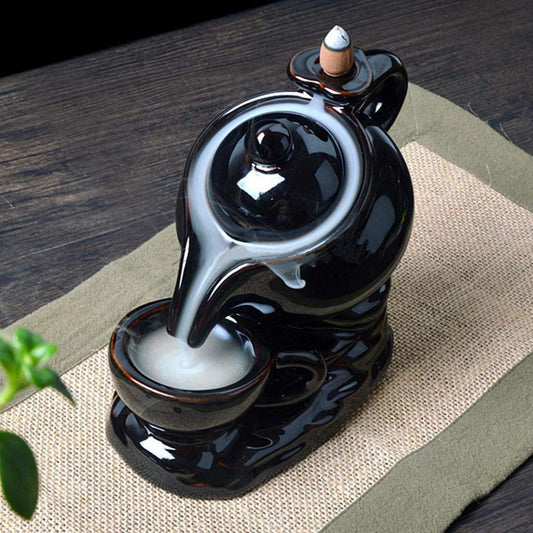 Ceramic Tea Kettle Backflow Incense Holder, Serene Aromatherapy Accent for Peaceful Spaces.